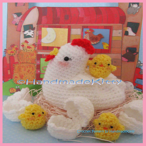 Mama Chicken with her Three little chicken babies