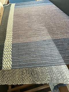 Pebble weave with a more consistent weft.