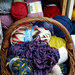 Wool in a basket at ACValley, in front of the wool racks.