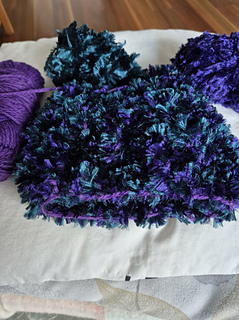 3 yarns held together - 8 ply plus two flurry yarns