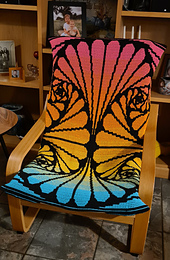 Interlocking filet crochet made into a 'fitted sheet' to cover the beige fabric of an IKEA Poang chair