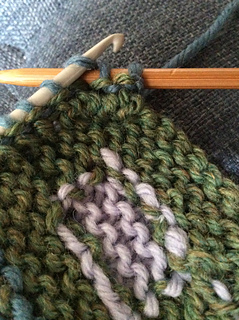 Knit directly off thin crochet hook after picking up stitches with the hook.