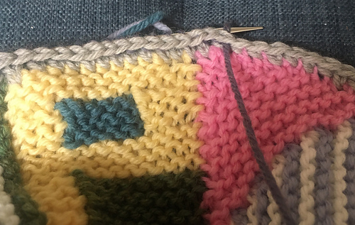 Added a row of single crochet along edges before picking up border.