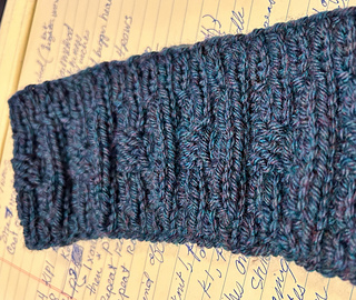 Blue/green/purple headband with varied rows of ribbing