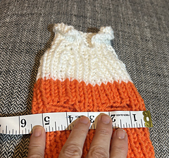 Large sweater measuring, unstretched across the chest.
