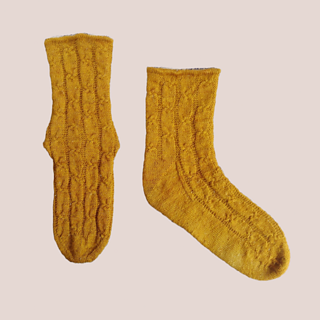The same mustard-gold socks laid flat.