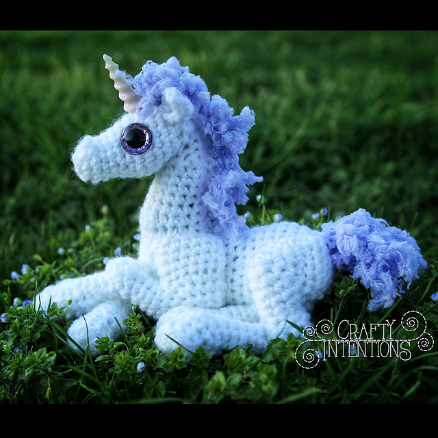 ravelry baby laying down unicorn pattern by megan lapp