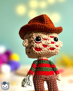 Handmade Freddy Krueger amigurumi inspired by Wes Craven’s A Nightmare on Elm Street, spooky Halloween crochet pattern PDF.