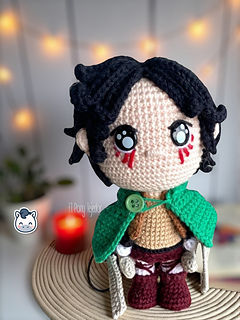 Handmade Eren Jaeger amigurumi inspired by Hajime Isayama’s Attack on Titan (Shingeki no Kyojin), a perfect crochet pattern for anime fans, otaku collections, and Funko-style plush lovers.