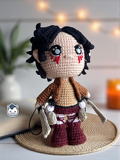 Handmade Eren Jaeger amigurumi inspired by Hajime Isayama’s Attack on Titan (Shingeki no Kyojin), a perfect crochet pattern for anime fans, otaku collections, and Funko-style plush lovers.