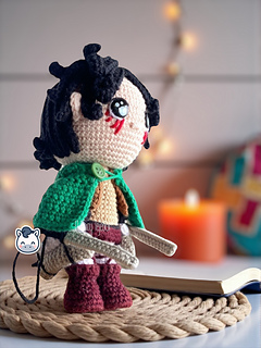 Handmade Eren Jaeger amigurumi inspired by Hajime Isayama’s Attack on Titan (Shingeki no Kyojin), a perfect crochet pattern for anime fans, otaku collections, and Funko-style plush lovers.