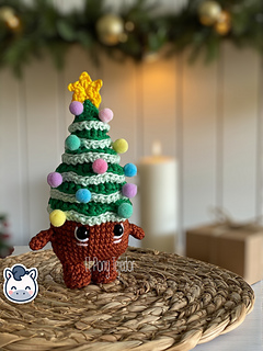 Handmade Christmas amigurumi set inspired by classic holiday ornaments, featuring a Christmas tree, festive candle and pinecone, perfect Christmas crochet pattern PDF for fans of winter decor and handmade holiday crafts.