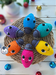 Handmade Christmas light string amigurumi inspired by cozy holiday decor, colorful kawaii Christmas crochet pattern PDF.