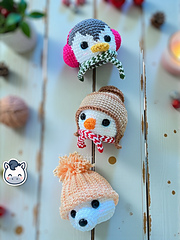 Handmade Christmas amigurumi ornaments featuring a snowman, penguin and polar bear, cute winter crochet pattern PDF for holiday tree decoration.