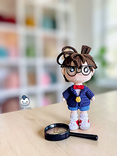 Detective Conan amigurumi crochet doll with glasses and blue jacket, handmade anime plush pattern PDF, geek amigurumi toy for manga and anime fans, kawaii crochet character design