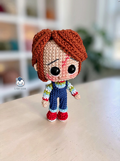 Handmade Chucky amigurumi inspired by the Child's Play horror movies, a detailed crochet PDF pattern featuring step-by-step instructions, perfect for Halloween, horror movie fans, and handmade doll collectors.