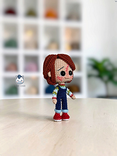 Handmade Chucky amigurumi inspired by the Child's Play horror movies, a detailed crochet PDF pattern featuring step-by-step instructions, perfect for Halloween, horror movie fans, and handmade doll collectors.