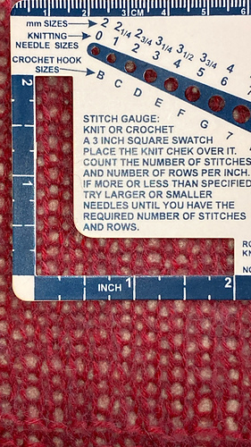 After aggressive blocking (as per Worsted Boxy instructions): 14 stitches and 25 rows
