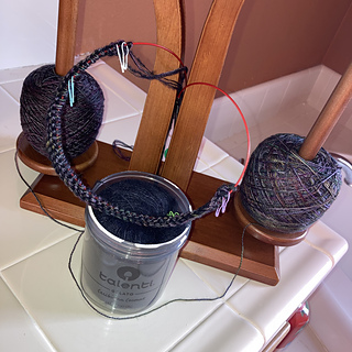 My set-up: a double-spooled yarn holder/dispenser and an empty gelato jar (fuzzy and/or slippery lace yarns work great in Talenti jars).

I've cast on, purled a row, and added my markers.

(Photographed at sunset, with flash)