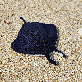 Pocket-sized knitted manta ray toy
