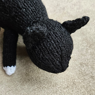 Black and white knitted cat