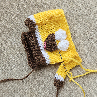 Knitted spongebob sewing up body