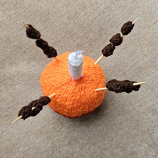 Knitted Christingle with Knitted Raisins on Sticks Top View