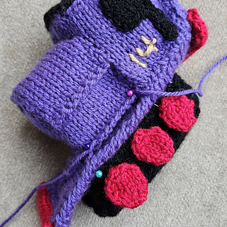 Knitting progress for knitted toy train