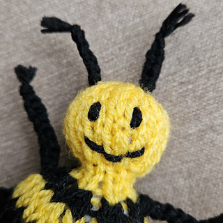 Knitted bee face