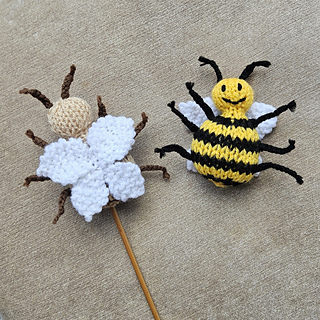 Two knitted bee toys front and rear view