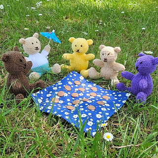 Collection of knitted teddies at a teddy bears picnic