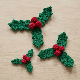 Knitted holly in three sizes