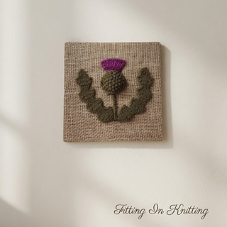 Knitted thistle picture on wall display