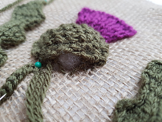 Sewing the knitted thistle head