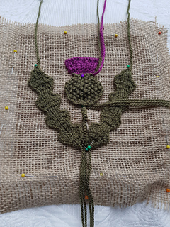Knitted thistle piecing together
