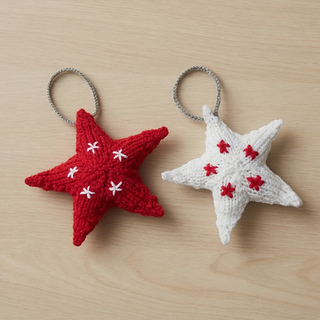 Pair of big knitted stars for Christmas tree decoration