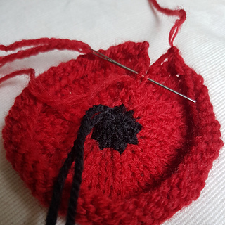 Sewing up Knitted Poppy