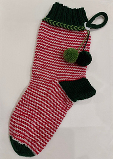 Love the pom poms on a Knitter's version!