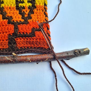 Falling leaves woodland wall hanging by Hookanory - Detail attaching the branches as hanging rods - all instructions are included in the pattern.