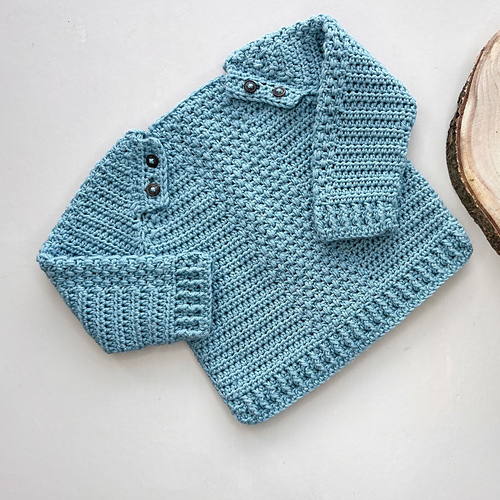 Ravelry Button Baby Sweater pattern by Hannah Cross