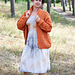 Cozy autumn crochet cardigan featuring a repeating striped pattern, perfect for layering in cooler weather.