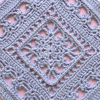 Close-up of center motif in lace crochet pattern square