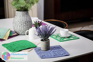 A crochet square in soft lavender tones, with alternating ridged and flat stitch patterns creating a striped texture.