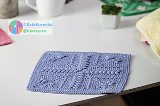 A square of crochet fabric, featuring raised textured stitches and clean edging.