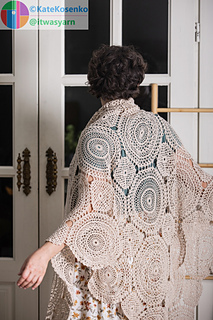 Handmade crochet shawl showing detailed openwork pattern