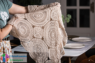 Lightweight crochet shawl with intricate lace motifs