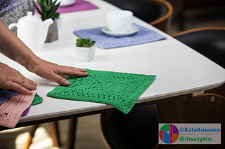 A full view of a green crocheted lace square named "March," measuring 11 inches on a light background.
