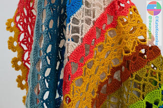 Crochet shawl pattern close-up highlighting panel construction and join-as-you-go technique