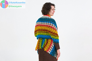 Back view of crochet shawl worn as belted wrap, showing length and panel construction