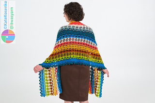 Back view of striped lace crochet shawl draped over shoulders, lightweight fabric and flowing shape
